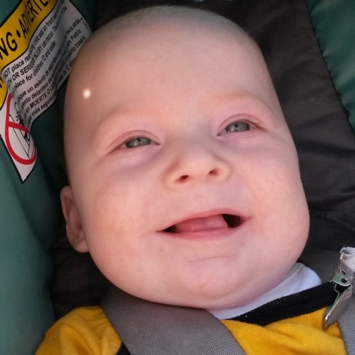 fred laughing in car seat